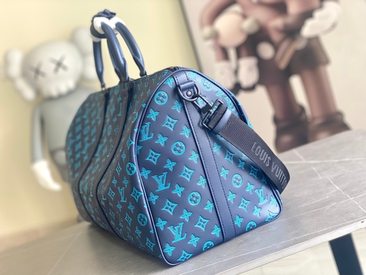 Bolsos azules calificados grandes de Keepall BANDOULIÈRE 50 para hombre Boston del bolso